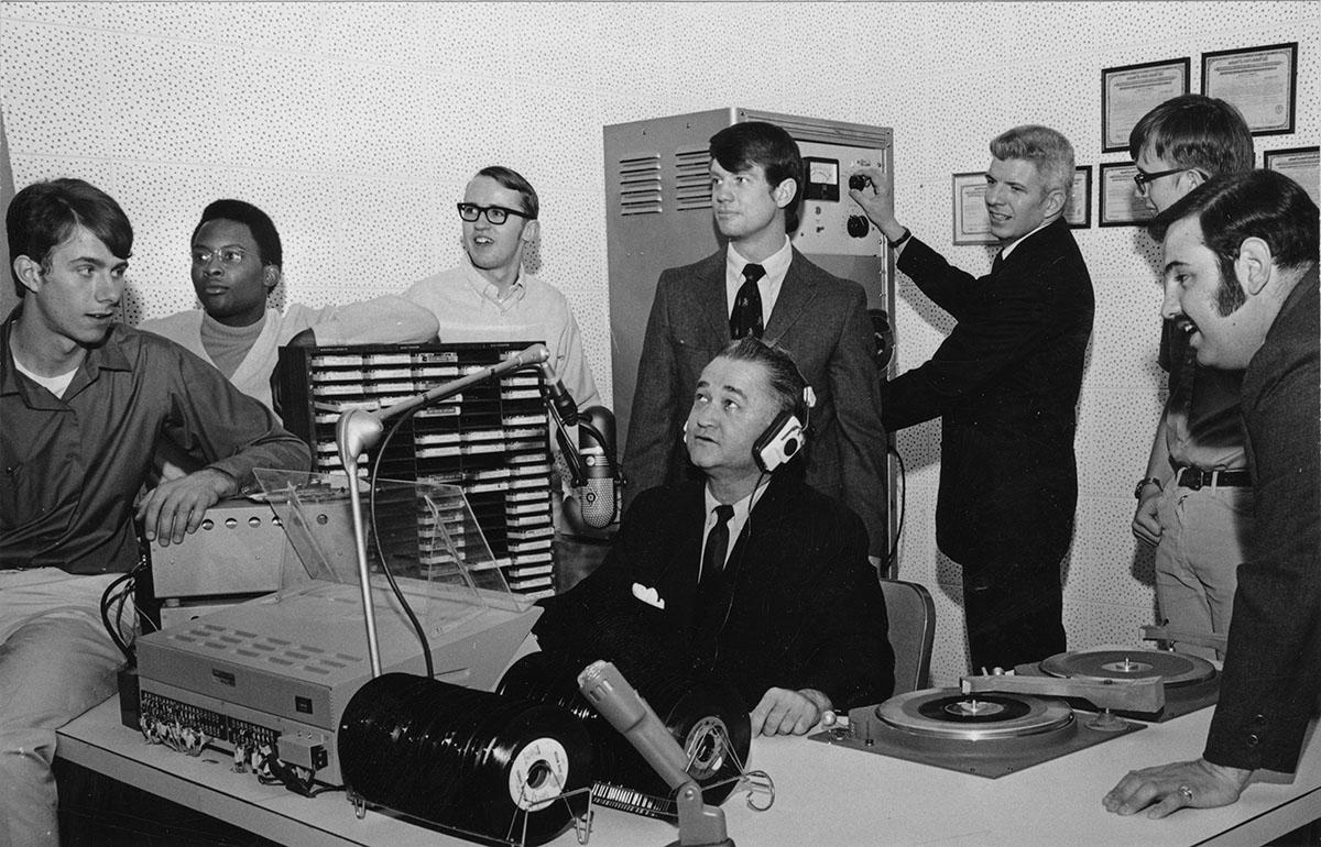 Robert Foster, who was instrumental in pushing for enhancements to Northwest's radio broadcast studios, tests some of the equipment with KDLX staff members in 1970.